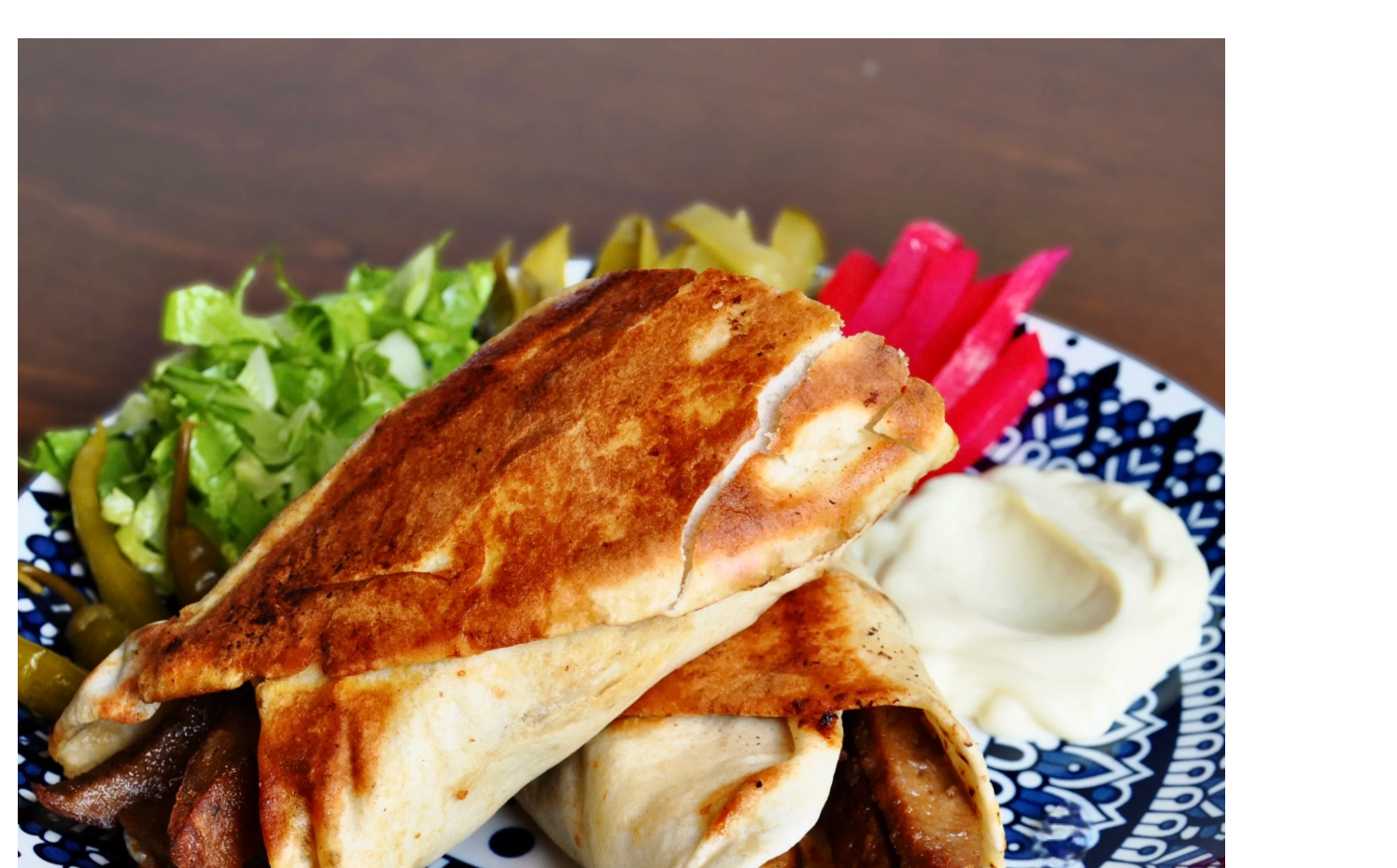 Shekho's shawarma sandwich with pickles, turnip and toum